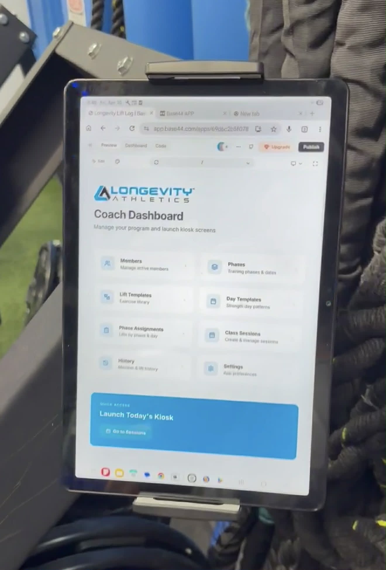iPad-based workout tracking system at Longevity Athletics personal training gym in Maricopa AZ, showing coach dashboard with member progress data