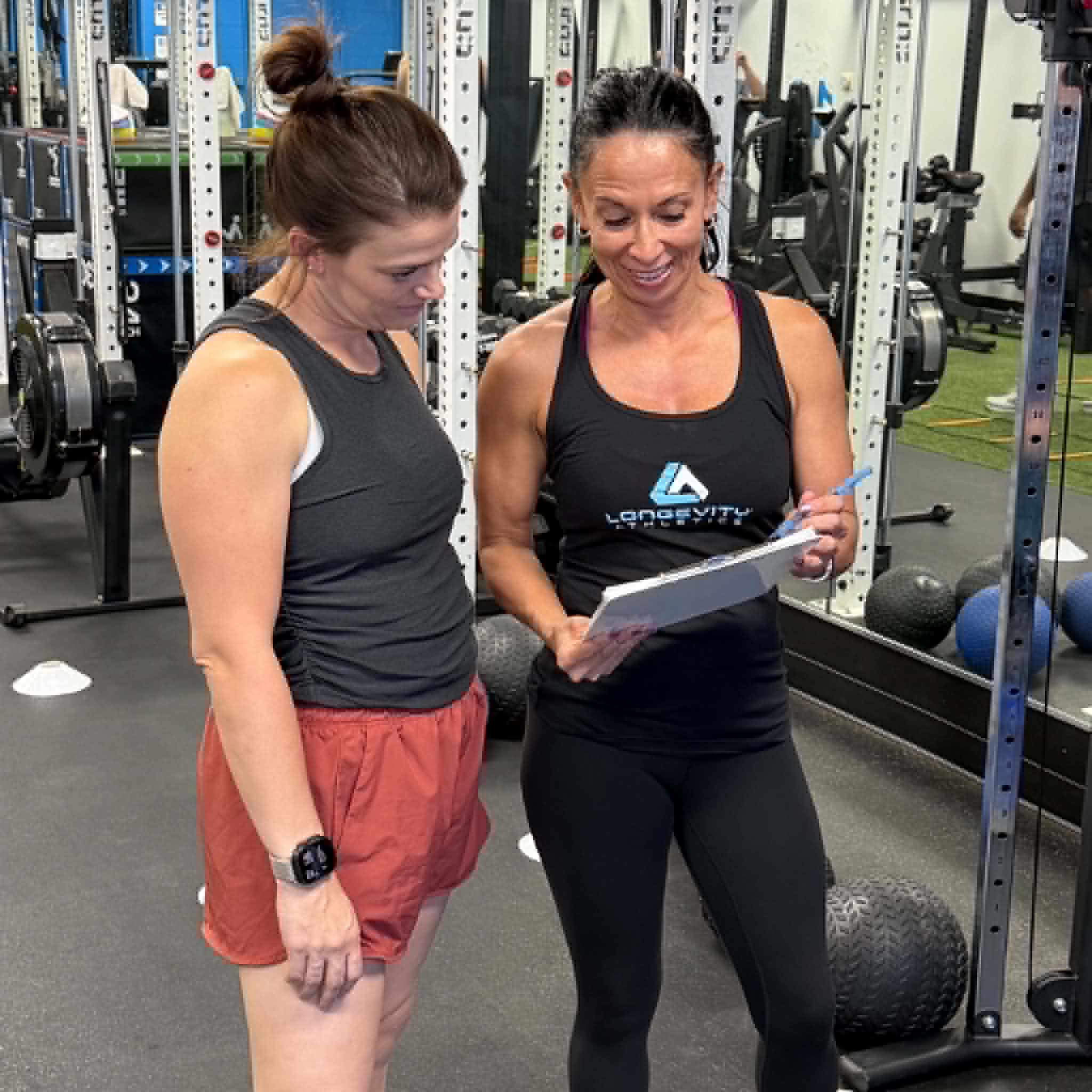 Longevity Athletics coach working with a member